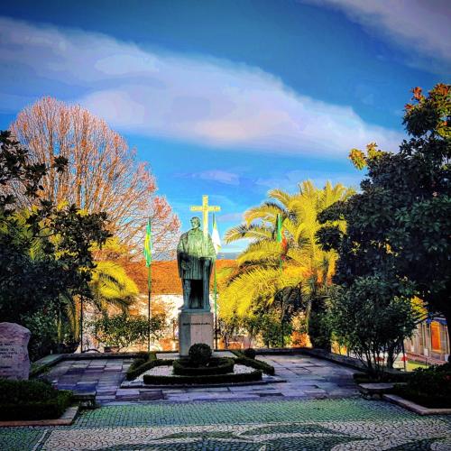 a monument with a cross in the middle of a park at Casa Dr. Saba in Belmonte