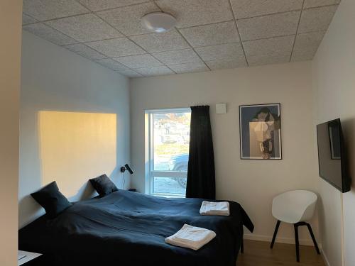 Кровать или кровати в номере Tuukkaq Apartments