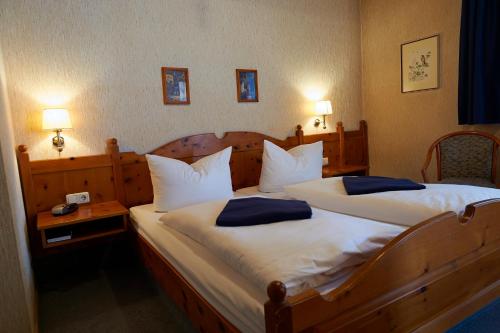 Postel nebo postele na pokoji v ubytování Hotel Walfisch