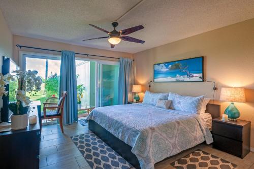 a bedroom with a bed and a ceiling fan at Kamahana 23 in Princeville