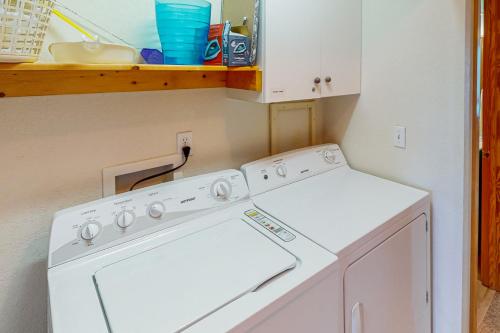 a white washer and dryer in a small kitchen at Beach Dreamer #4-BB in Buxton