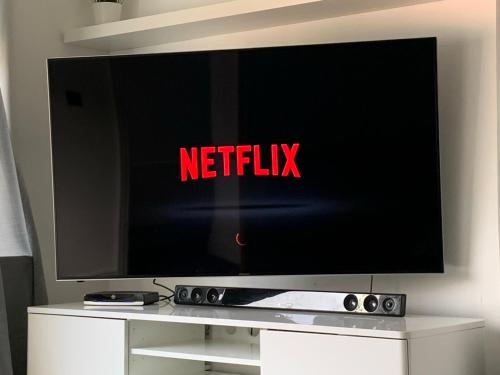 a flat screen tv with the words netflix on it at Beautiful house in a perfect location in Saint Annes on the Sea