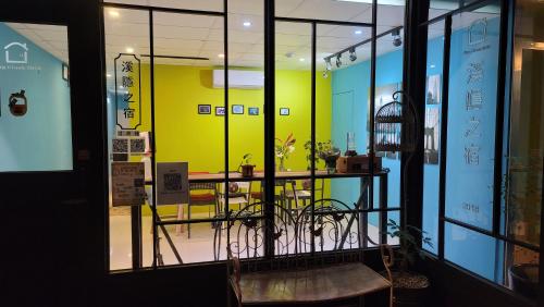 a window of a store with a bird cage in it at Xi Yin Zhi Su in Pingxi