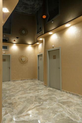 an empty room with two doors and a ceiling at Hotel CITY Petrich in Petrich