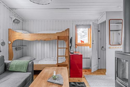 a living room with a bunk bed and a couch at Gilleråsvägen 13 C in Sälen