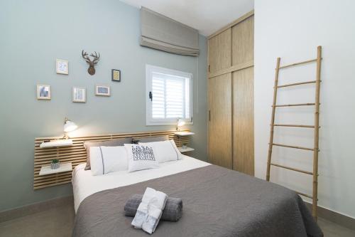 מיטה או מיטות בחדר ב-Beautiful apartment in Tel Aviv