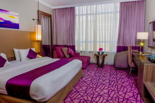 Postel nebo postele na pokoji v ubytování Aquila ALdiafah Hotel