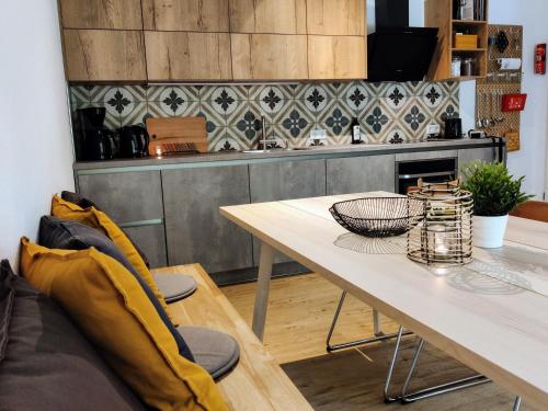 a table and chairs in a kitchen with a counter at Elpe Apartments Hochsauerland in Elpe