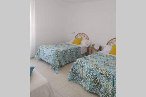 A bed or beds in a room at La casa del pueblo