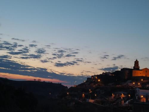a view of a city at night with a cloudy sky at Il Centro Storico in Grottole