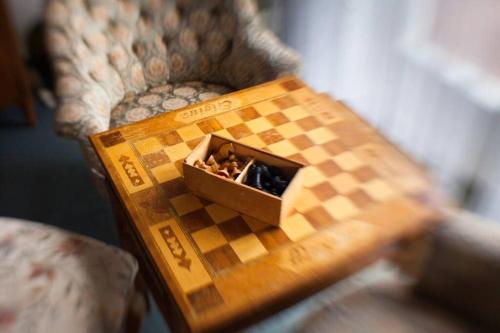 a wooden chess set sitting on top of a table at Beautiful cosy House near Königsee in Schönau am Königssee