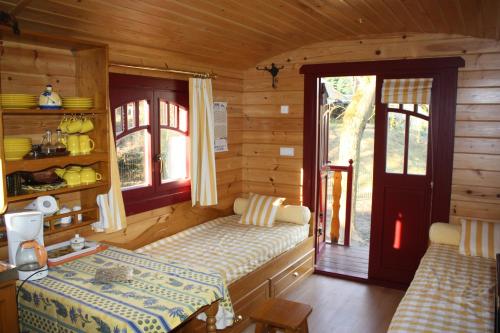 Voodi või voodid majutusasutuse La Gypsy Caravan toas