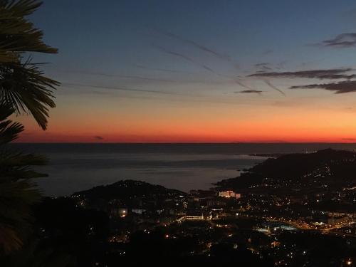 a view of the ocean at sunset at Villa Panorama 360 in Lloret de Mar