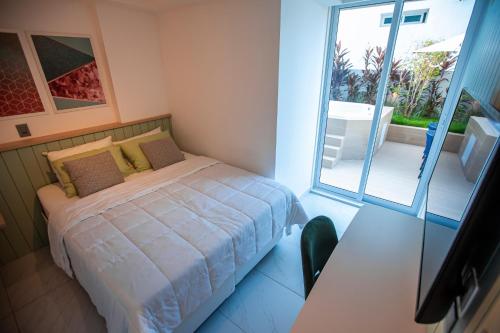 Un pat sau paturi într-o cameră la Apartamento Com Jacuzzi na Beira mar de João Pessoa no Branco Haus