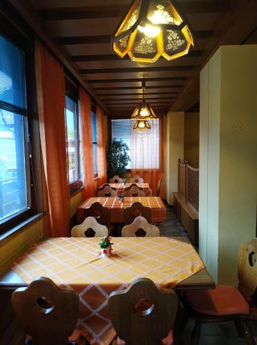 a room with a table and two beds in it at Ludwighaus in Neukirchen am Großvenediger