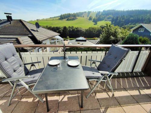 a table and two chairs on a balcony at Ferienwohnung Marx, K1 Blick, Willingen, Hoppecketal, Waschmaschine, Trockner in Willingen