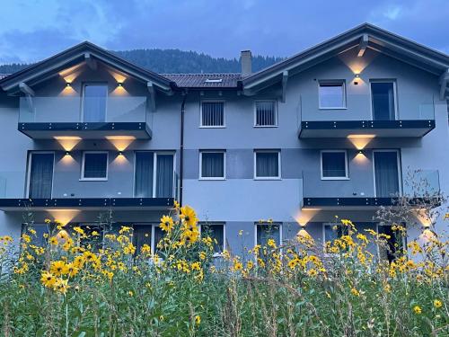 a building with lights on the side of it at ROSENSUITE La Residenza del rosengarten in Pinzolo