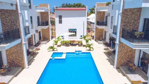 an aerial view of a swimming pool in a building at Mica Apartments in Sere Kunda
