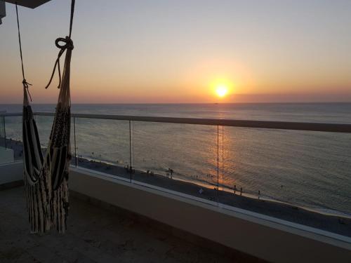 a sunset from the balcony of a condo at Deluxe Spectacular Sunset in Santa Marta