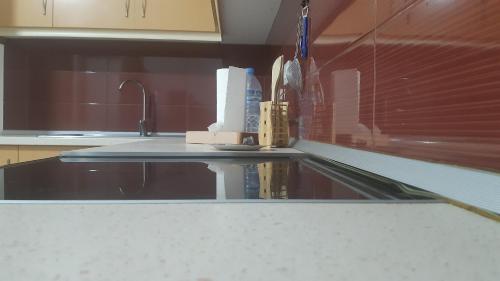 a kitchen with a sink and a counter top at Home Sweet Home 3 - Guest House in Tirana