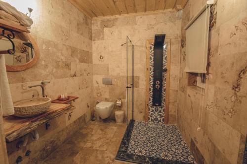 a bathroom with a sink and a toilet at Rose Valley Hotel in Goreme