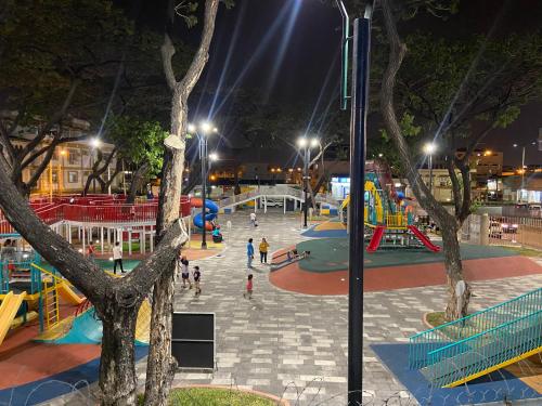 a playground at night with people playing in it at WHITE HOUSE in Guayaquil