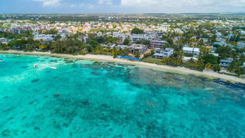 an aerial view of a beach in the ocean at ONE BAY Residence Apartment 3 Luxury Unit Grand Baie in Pereybere