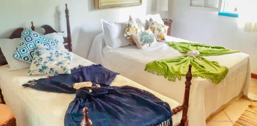 Ein Bett oder Betten in einem Zimmer der Unterkunft Aretê Ilha Grande