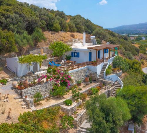 an aerial view of a house on a hill at The Rock & The Lemon Tree in Sitia