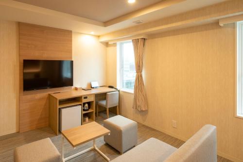 Televisyen dan/atau pusat hiburan di HOTEL AMANEK Asahikawa