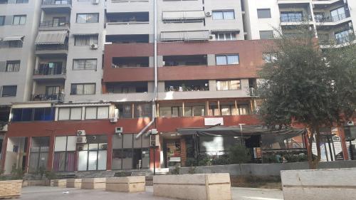 a large apartment building with a lot of windows at Home Sweet Home 3 - Guest House in Tirana