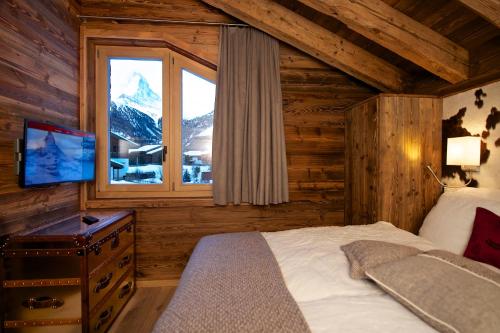Postel nebo postele na pokoji v ubytování Chalet Matterland
