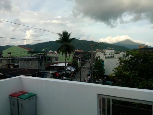 a view of a city from the balcony of a building at Leonor's Transient House in Polangui