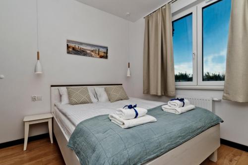 Postel nebo postele na pokoji v ubytování BlueApart Apartamenty Hotelowe Nexo