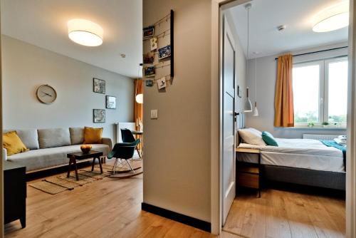Postel nebo postele na pokoji v ubytování BlueApart Apartamenty Hotelowe Nexo
