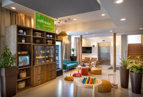 a lobby with a waiting area with a room with agamuitous at Sunny Baška Residence by Valamar, ex Zvonimir in Baška