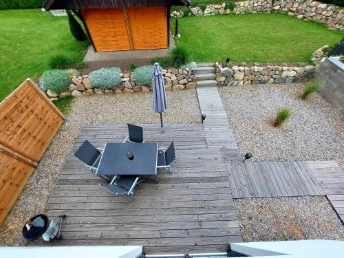 an overhead view of a patio with a table and an umbrella at Ferienhaus Britta Kietzmann in Feldberg