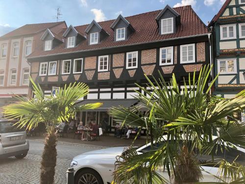 a white car parked in front of a building at Celle Old Town Hideaway in Celle