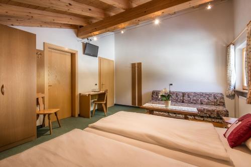 Cama o camas de una habitación en Ciasa Roch