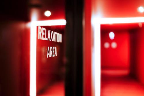 a red room with a sign that reads redeeming area at Jaz in the City Vienna in Vienna