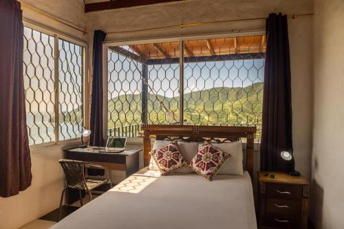 Ένα ή περισσότερα κρεβάτια σε δωμάτιο στο Casa Blanca - Taganga