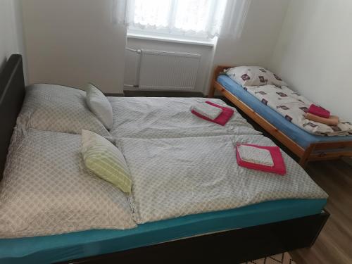 a bedroom with a bed with towels on it at Flat in the Heart of Liptovsky Mikulas in Liptovský Mikuláš