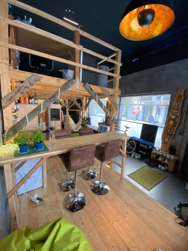 a room with a desk and a loft bed at Jonnys Loft in Osnabrück