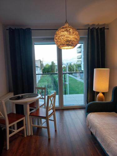 Posteľ alebo postele v izbe v ubytovaní Apartament - malowniczy Augustów