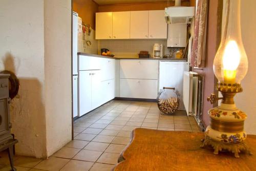 Virtuvė arba virtuvėlė apgyvendinimo įstaigoje La Petite Maison