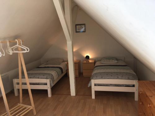 Postel nebo postele na pokoji v ubytování Gite des 3 cigognes