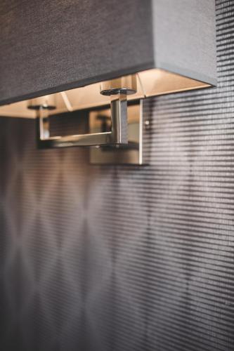 a close up of a stove top in a bathroom at Aparthotel New Lux in Wrocław