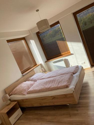 Postel nebo postele na pokoji v ubytování Donovaly Panoráma 26