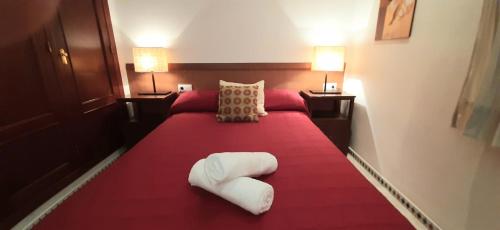 Ένα ή περισσότερα κρεβάτια σε δωμάτιο στο Apartamento con buhardilla casco histórico