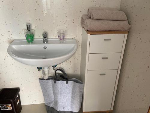 a bathroom with a white sink and a counter at Sarahs Kite Vivienda Vacacional en Playa del Burrero in Playa del Burrero